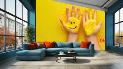 Hands view children hand painted with smiling face on yellow background. Generative AI. Wall mural