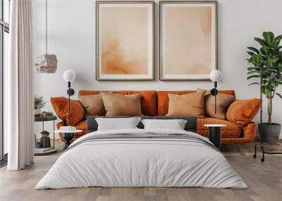 Modern living room with terracotta couch and two vertical picture frames for wall art mockup. Wall mural