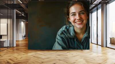 portrait of a smiling young woman in work clothes Wall mural