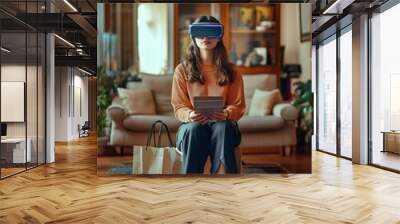 Smart shopping. A woman is shopping with her augmented reality glasses in her living room. Buying online with an AR/VR headset , technology concept. Wall mural