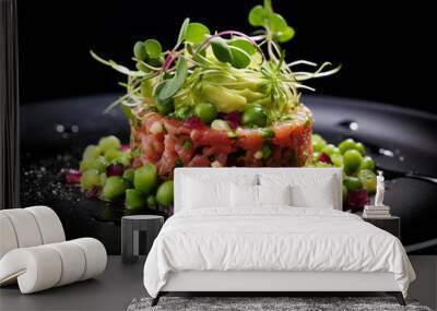 Tuna tartare with avocado and green peas on a black background  Wall mural