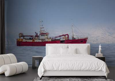 Commercial fishing boat sailing near the coast of Iceland. Wall mural