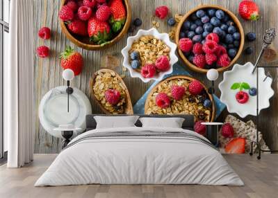 Fresh healthy breakfast with muesli and berries, vitamins, wooden background Wall mural