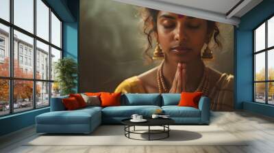 a beautiful tamil woman , hands in prayer , eyes closed Wall mural