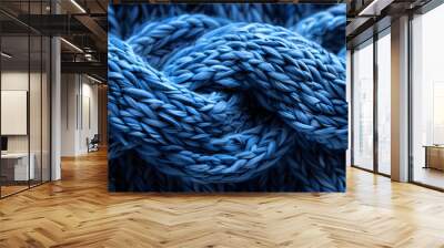 A closeup of a woolen blue sweater with intricate braids, reminiscent of denim and electric blue hues, resembling a rope design Wall mural