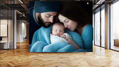 A man and woman are holding a baby in a blue blanket Wall mural