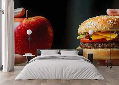 A person making a choice between a healthy apple and a junk food hamburger Wall mural