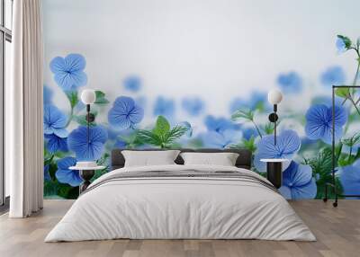 A single image with a blue flower field on a white backdrop featuring green foliage and centered text Wall mural