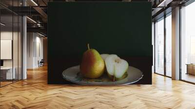 A sliced pear on an art deco plate Wall mural