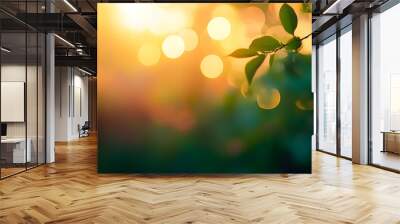 A summer sunset, sunrise background with lush green foliage and orange glow sky with blurred spring bokeh highlights. Wall mural