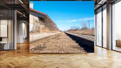 A view along the track of the old, historic Grand Trunk Railway beside the station in St. Mary's, Ontario, on a bright sunny autumn day. Wall mural