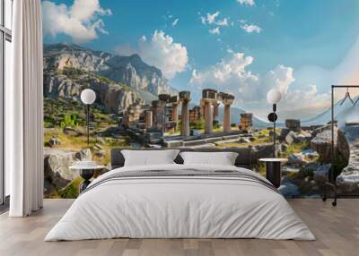 Ancient temple in Greece, view of Greek ruins on mountain and sky background, landscape with old historical building, sun and rocks. Theme of antique, travel and culture Wall mural