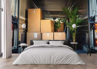 Back of a moving truck with cardboard boxes and a plant, interior Wall mural