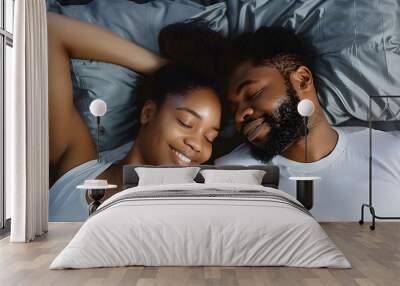 Black couple and eye contact in bed with romance for love with tender, embrace and care in morning with smile. Dating, relationship and relaxing with passion for partner with comfort or waking up. Wall mural