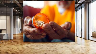 close up of man at home sitting down handling prescription pill bottle Wall mural