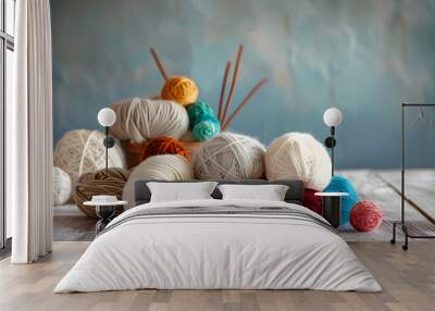 Colorful balls of wool on wooden table. Variety of yarn balls Wall mural