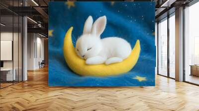 cute little white rabbit is sleeping on a yellow crescent moon. The background is a blue starry sky Wall mural