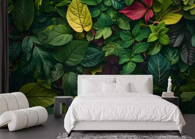 Foliage background with a variety of vibrant plant leaves showing a diverse ecosystem and the biodiversity of nature. Wall mural