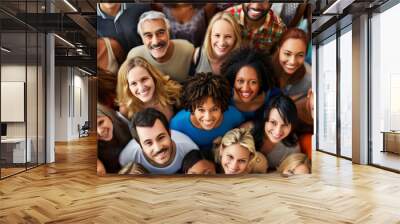 From directly above multi ethnic large group of people looking at camera Wall mural