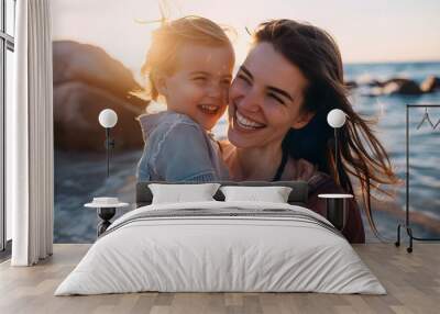 Happy mother and little boy smiling at the beach Wall mural