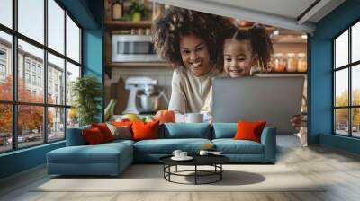 Low Angle photo of a Mother with kid collaborate over a laptop in a well-lit, contemporary kitchen, sharing smiles and a casual work moment Wall mural