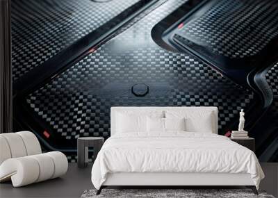 Metallic plate with carbon fiber texture, futuristic shapes, it has an industrial look reminiscent of car parts or sports equipment Wall mural