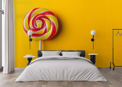 Minimalist candy pop poster featuring a single colorful lollipop on a yellow backdrop with copy space image Wall mural