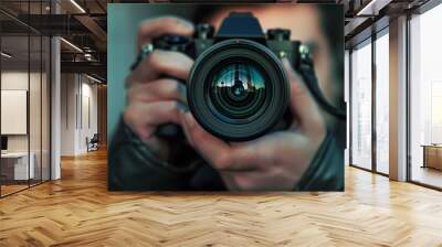 photographer take pictures Snapshot with camera. man hand holding with camera looking through lens.Concept for photographing articles Professionally. Wall mural