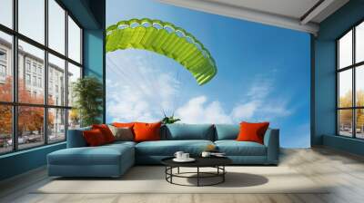 real photo of a real green parachute in the sky Wall mural