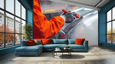 Repair and painting car car mechanic. Auto mechanic worker painting car in a paint chamber during repair work. Auto repairman plastering autobody bonnet. Wall mural