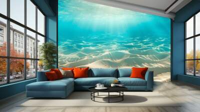 seabed sand with blue tropical ocean above empty underwater background with the summer sun shining brightly creating ripples in the calm sea water. Wall mural