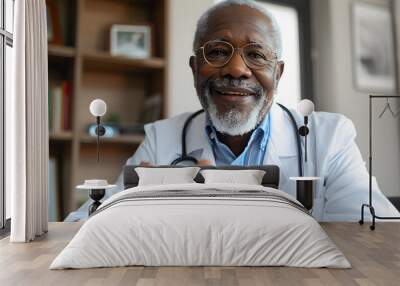 Senior african american male doctor with stethoscope, having video call for online consultation Wall mural