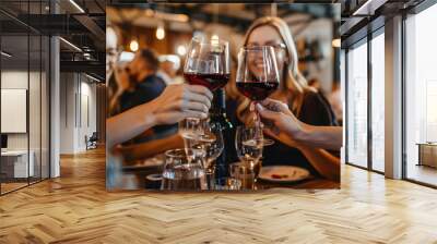 Smiling friends toasting with wine in restaurant Wall mural