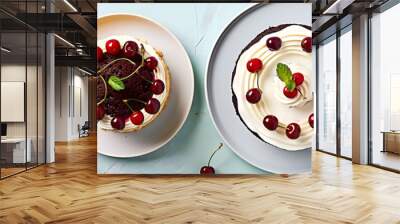 Top view of an appetizing cake with cream and cherry berries on a two color mint background set against a white backdrop The image offers a flat lay composition with plenty of copy space Wall mural