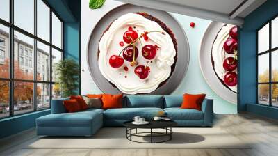 Top view of an appetizing cake with cream and cherry berries on a two color mint background set against a white backdrop The image offers a flat lay composition with plenty of copy space Wall mural