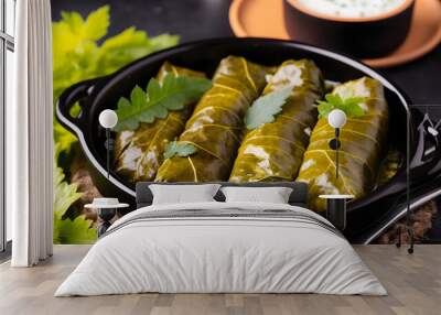 Traditional Greek, Caucasian and Turkish cuisine. Delicious dolma - stuffed grape leaves with rice and meat on a dark stone background. Wall mural