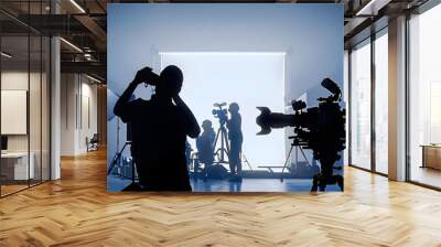 Video or film production studio used in shooting videography or photography and photo sets. Professional movie camera and film crew team making film scenes for cinema TV or online advertising works. Wall mural