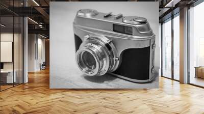 Vintage 1980s 35mm film camera in black and white isolated. Wall mural