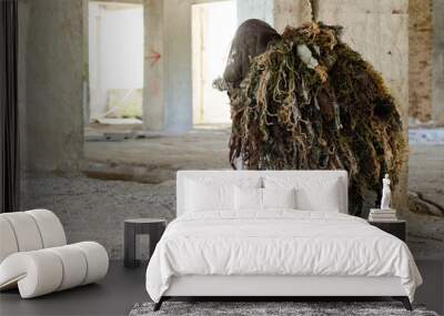 Sniper kneeling supported firing position ghillie suit ,inside building take cover  Wall mural