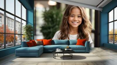 A closeup photo portrait of a cute beautiful young girl kid smiling with clean teeth. used for a dental ad. teen with fresh stylish long hair.  Wall mural