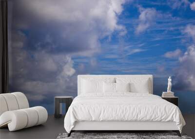 White fluffy clouds with a beautiful blue sky Wall mural