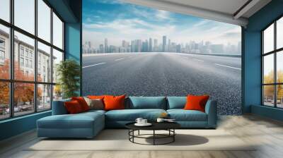 Low angle view of asphalt highway road and city skyline background Wall mural