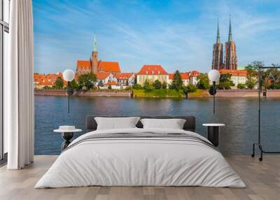 A view of Ostrów Tumski in Wrocław on a sunny day. In the background, you can see the Cathedral of St. John the Baptist. Wall mural