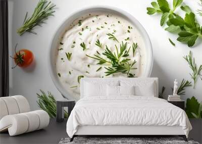 Bowl of sour cream dip sauce with herbs isolated on white background, top view
 Wall mural