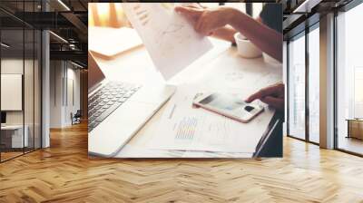 Business people at work on stock market charts in office. Meetin Wall mural