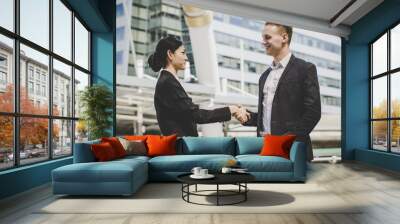 Business people shaking hands, finishing up meeting deals. Business concept. Wall mural