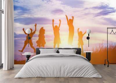 Silhouette of children jump gladness happy time Wall mural