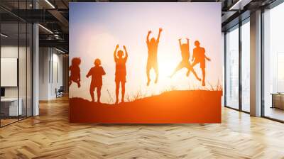 Silhouette of children jump gladness happy time Wall mural