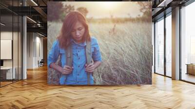 Vintage tone images of beautiful young hipster woman with backpack Wall mural