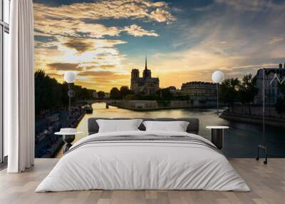 Notre damme cathedral under beautiful colrful sky during golden hour Wall mural